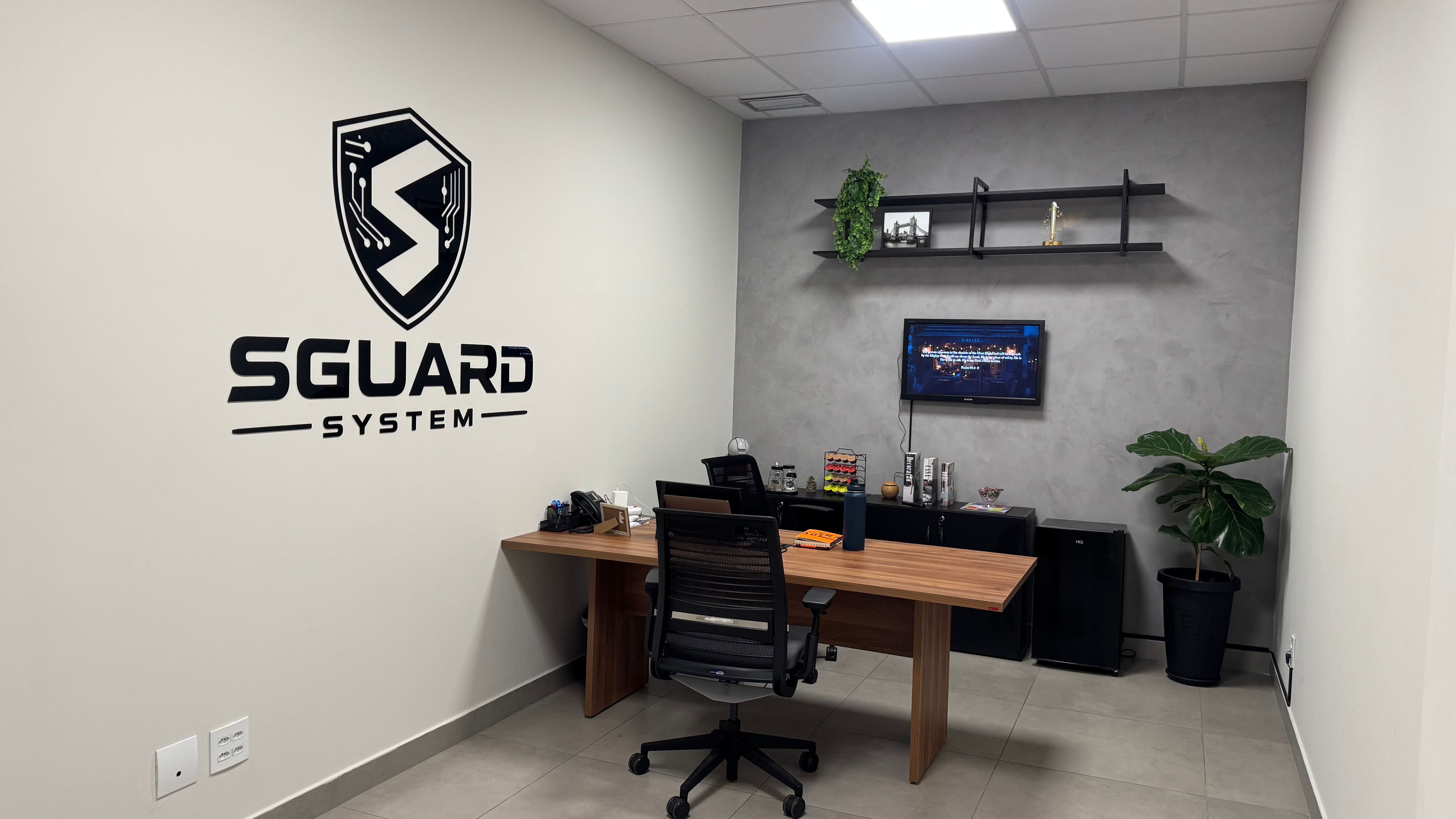 SGuard System office with the company brand on the wall